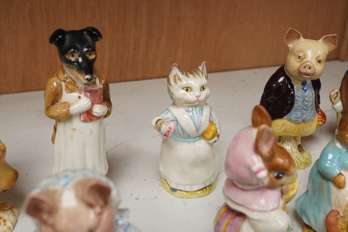 A collection of thirteen Beatrix Potter character figures, stamped with a gold stamp F Warn and Co Ltd, Beswick England, largest 12cm high